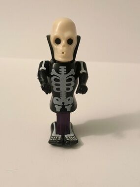 Vintage PEZ Halloween Skull & Skeleton Body Parts Purple Dispenser